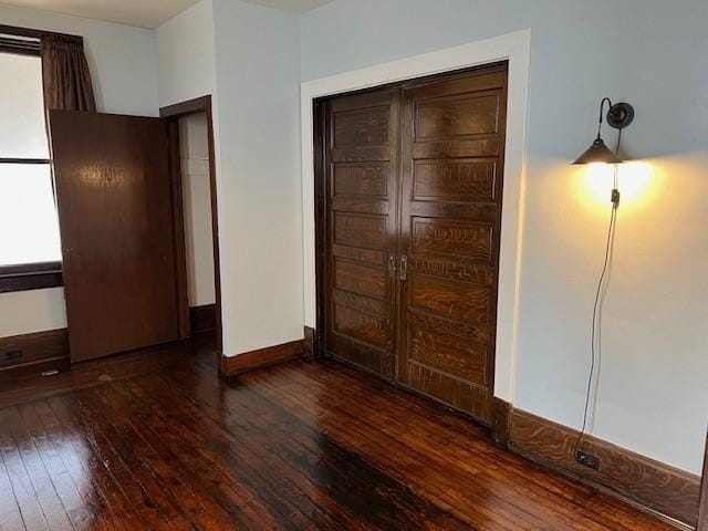 201 Thompson St, Latrobe, PA 15650 - unfurnished bedroom featuring hardwood / wood-style flooring, a closet, and baseboards