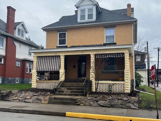 201 Thompson St, Latrobe, PA 15650 - traditional style home with covered porch and brick siding