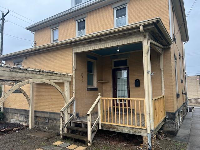 201 Thompson St, Latrobe, PA 15650 - rear view of house featuring brick siding