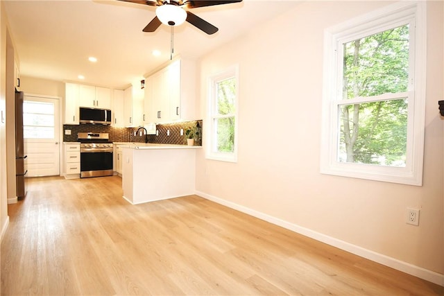 4 Brentwood Dr, Kennedy Twp, PA 15136 - kitchen featuring appliances with stainless steel finishes, baseboards, plenty of natural light, and recessed lighting