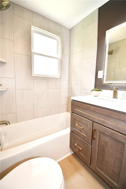 4 Brentwood Dr, Kennedy Twp, PA 15136 - full bathroom with vanity, wood finished floors, toilet, and tub / shower combination