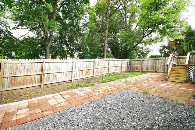 4 Brentwood Dr, Kennedy Twp, PA 15136 - fenced backyard with a patio, stairs, and a deck