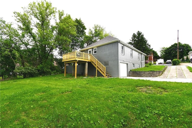 4 Brentwood Dr, Kennedy Twp, PA 15136 - rear view of house with a garage, a wooden deck, stairs, and a yard