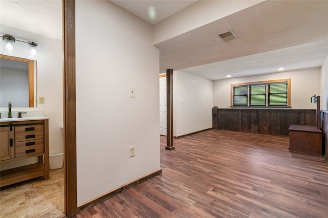 916 Timberland Ave, Brookline, PA 15226 - empty room featuring a sink, wood finished floors, and baseboards