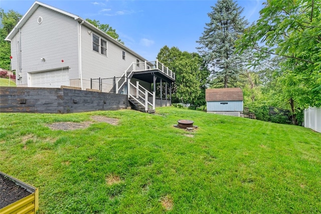 916 Timberland Ave, Brookline, PA 15226 - view of yard with stairway, a deck, a fire pit, and a garage