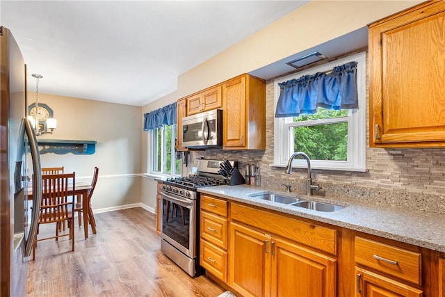 2400 James St, Hopewell Twp Bea, PA 15001 - kitchen featuring appliances with stainless steel finishes, a sink, plenty of natural light, and backsplash