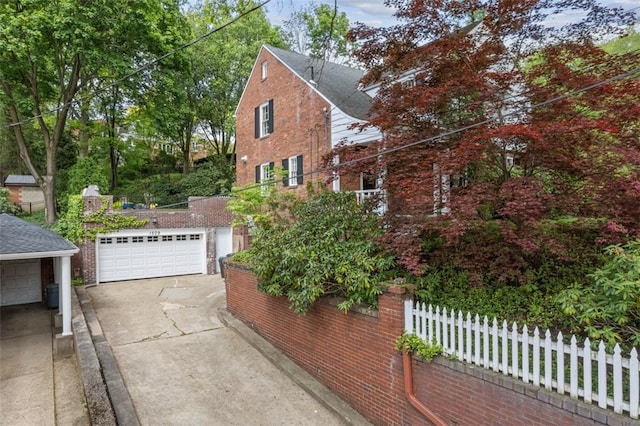 1509 Walnut St, Edgewood, PA 15218 - view of side of home with brick siding and a detached garage