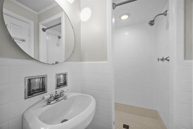 1509 Walnut St, Edgewood, PA 15218 - full bathroom with a tile shower, a sink, crown molding, tile walls, and wainscoting