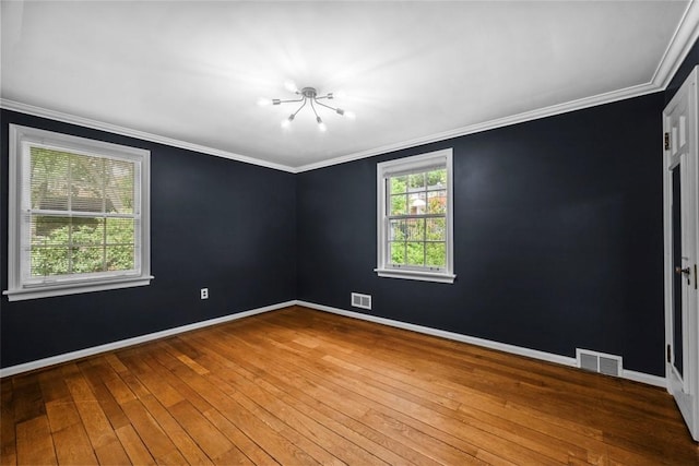 1509 Walnut St, Edgewood, PA 15218 - spare room featuring crown molding, hardwood / wood-style floors, a chandelier, and baseboards