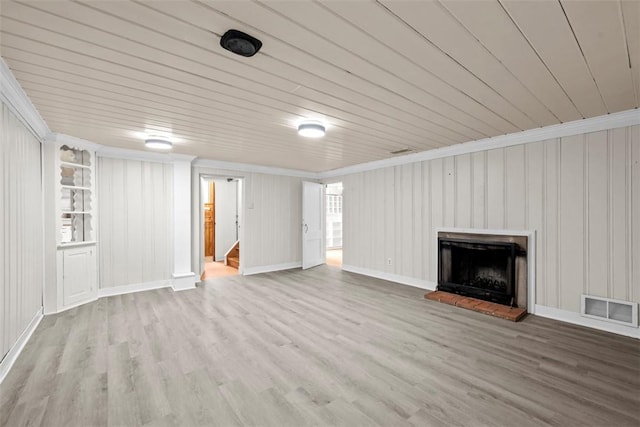 1509 Walnut St, Edgewood, PA 15218 - unfurnished living room featuring wood finished floors, a fireplace with raised hearth, wood ceiling, and stairs