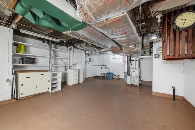 1509 Walnut St, Edgewood, PA 15218 - basement with heating unit, a sink, and baseboards