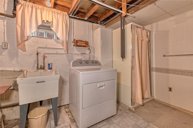 13749SAINTCLAIRDRIVE Circle Dr, North Huntingdon, PA 15642 - laundry room with washer / dryer, light flooring, concrete block wall, and baseboards