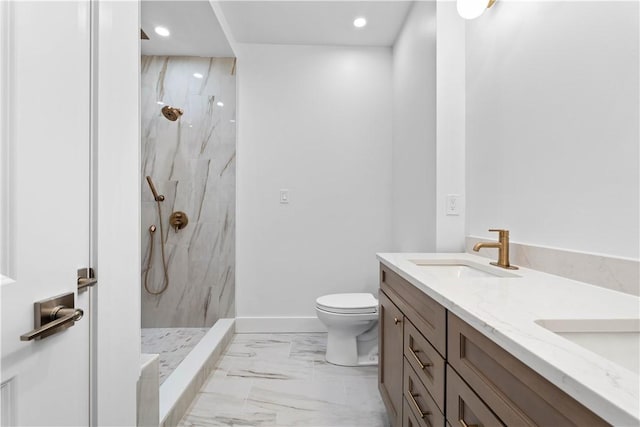 244 44th St, Lawrenceville, PA 15201 - full bath with marble finish flooring, double vanity, a marble finish shower, toilet, and recessed lighting