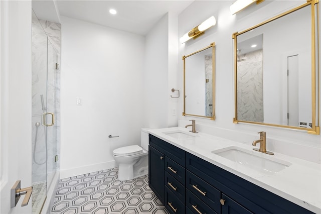244 44th St, Lawrenceville, PA 15201 - full bath featuring a marble finish shower, double vanity, toilet, recessed lighting, and tile patterned floors