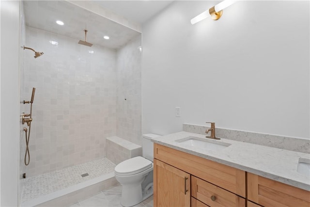 244 44th St, Lawrenceville, PA 15201 - full bathroom featuring vanity, a tile shower, marble look tile flooring, toilet, and recessed lighting