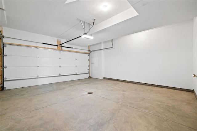 244 44th St, Lawrenceville, PA 15201 - garage with a garage door opener and baseboards