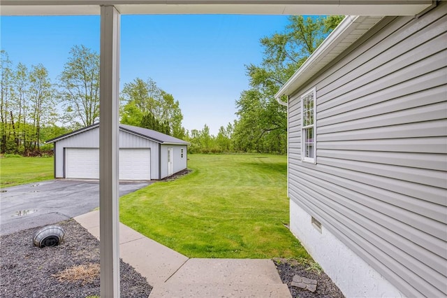 4624 Clear Shade Dr, Windber, PA 15963 - view of green lawn featuring a detached garage and an outdoor structure