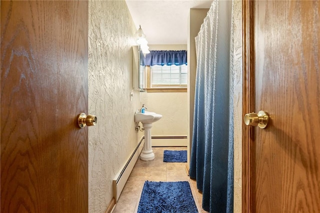 4624 Clear Shade Dr, Windber, PA 15963 - bathroom featuring a textured wall, baseboards, tile patterned floors, a baseboard heating unit, and a baseboard radiator