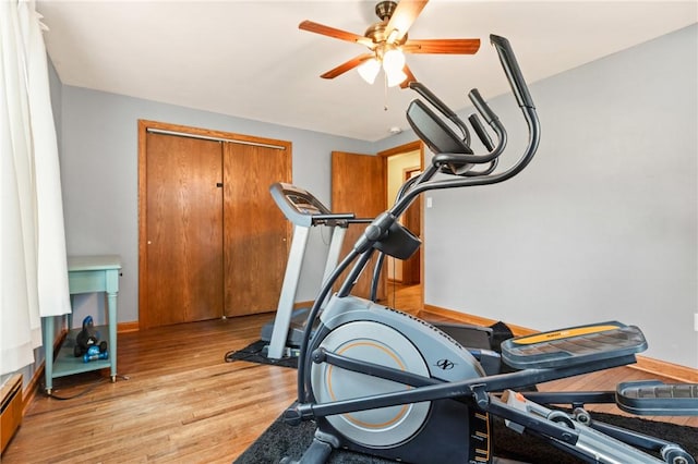 4624 Clear Shade Dr, Windber, PA 15963 - workout area featuring ceiling fan, light wood-style flooring, baseboard heating, and baseboards
