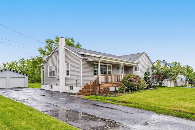 4624 Clear Shade Dr, Windber, PA 15963 - ranch-style house with covered porch, an outdoor structure, a garage, a front yard, and a chimney