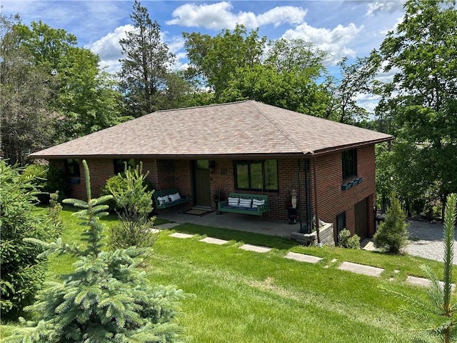 1050 Overlook Dr N, Franklin Twp, PA 15301 - view of front of home featuring a garage, a shingled roof, a front lawn, brick siding, and driveway