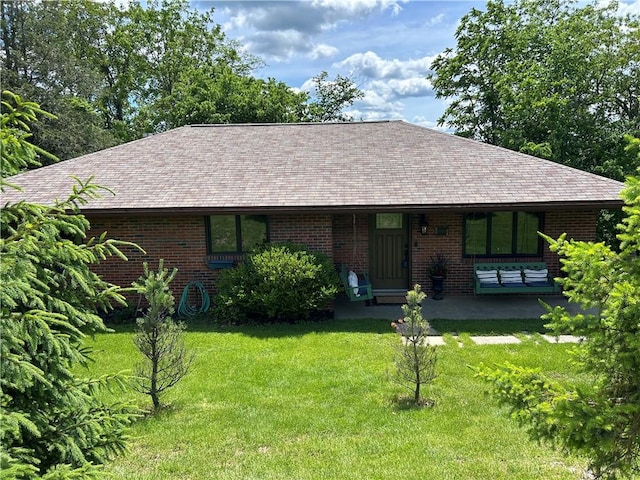 1050 Overlook Dr N, Franklin Twp, PA 15301 - view of front of property featuring a front yard, a shingled roof, and brick siding