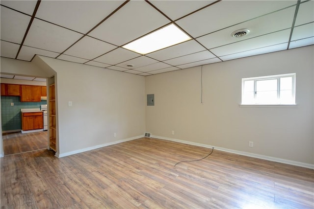 61/63 Orchard, Mckees Rocks, PA 15136 - basement with wood finished floors, baseboards, a drop ceiling, and electric panel