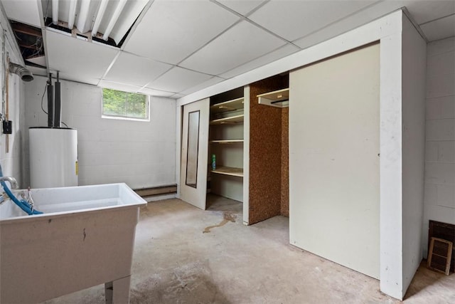 724 Camp Meeting Rd, Bell Acres, PA 15143 - below grade area featuring water heater, concrete block wall, and a sink