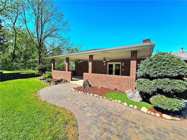2977 Clay Pike, Sewickley Twp, PA 15678 - view of front facade with a ceiling fan, a chimney, and brick siding