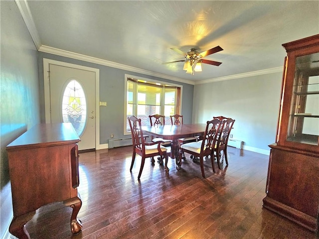 2977 Clay Pike, Sewickley Twp, PA 15678 - dining room with dark wood-style flooring, baseboard heating, ceiling fan, ornamental molding, and baseboards