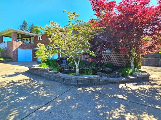 2977 Clay Pike, Sewickley Twp, PA 15678 - view of front of house featuring driveway and brick siding