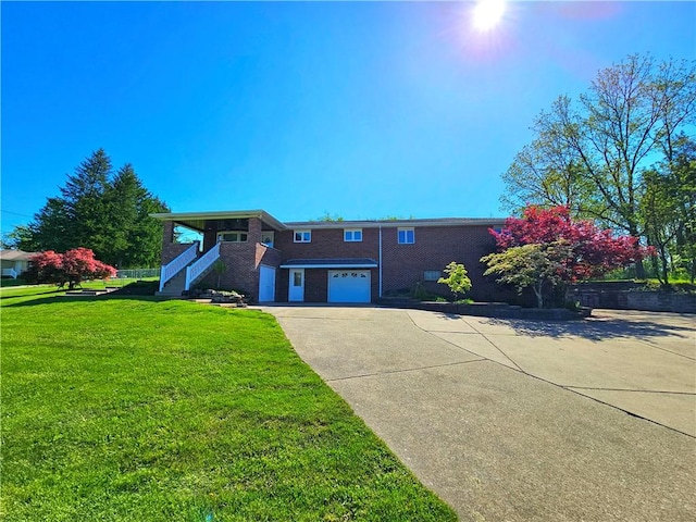 2977 Clay Pike, Sewickley Twp, PA 15678 - view of front of home with stairs, concrete driveway, a front yard, and brick siding