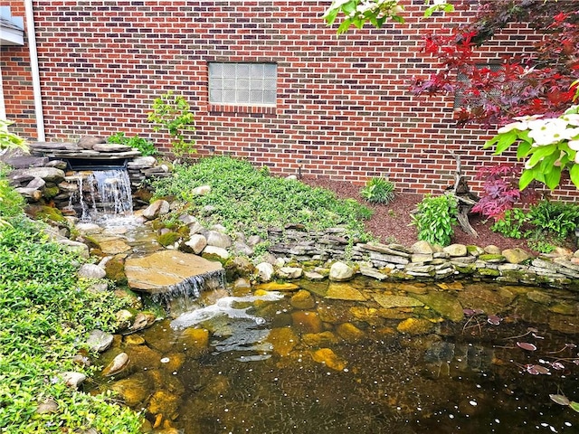 2977 Clay Pike, Sewickley Twp, PA 15678 - exterior view of a garden pond and brick siding