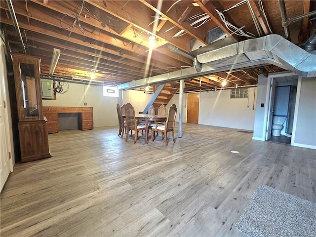 2977 Clay Pike, Sewickley Twp, PA 15678 - below grade area featuring wood finished floors, electric panel, and stairs