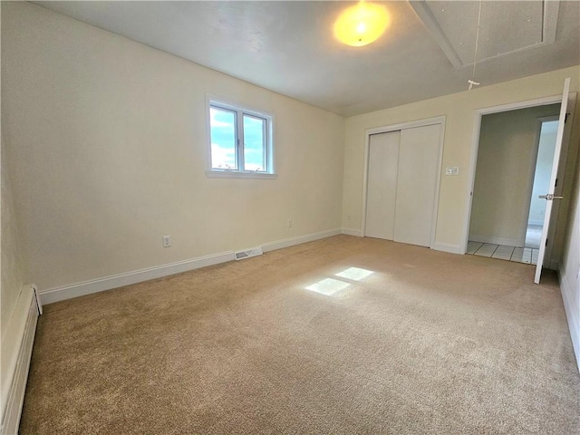 2977 Clay Pike, Sewickley Twp, PA 15678 - unfurnished bedroom with attic access, light carpet, a baseboard radiator, a closet, and baseboards