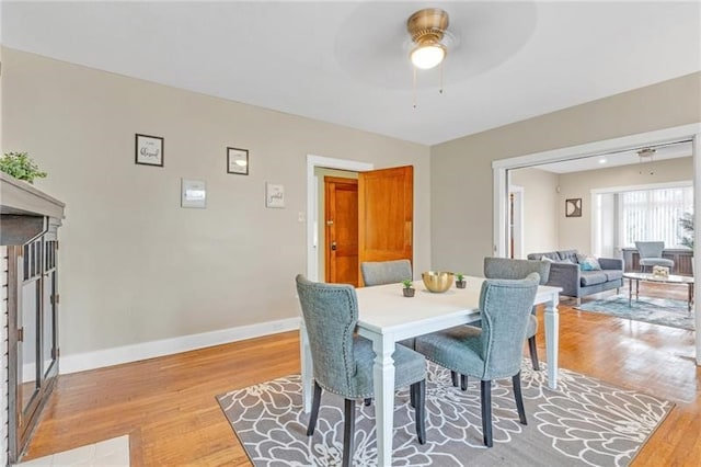 901 Ross Ave, Wilkinsburg, PA 15221 - dining room featuring light wood-type flooring, a ceiling fan, and baseboards