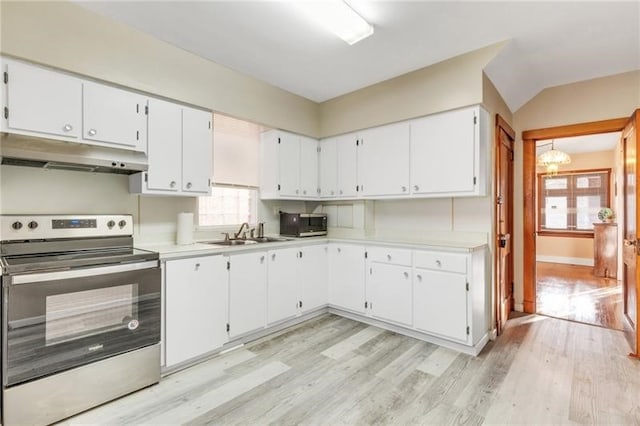 901 Ross Ave, Wilkinsburg, PA 15221 - kitchen with appliances with stainless steel finishes, under cabinet range hood, a sink, light wood-type flooring, and light countertops