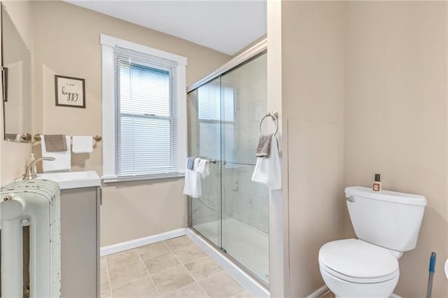 901 Ross Ave, Wilkinsburg, PA 15221 - full bath featuring toilet, a shower stall, baseboards, vanity, and tile patterned floors