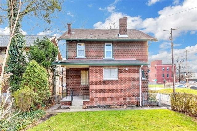 901 Ross Ave, Wilkinsburg, PA 15221 - back of property with a chimney and brick siding