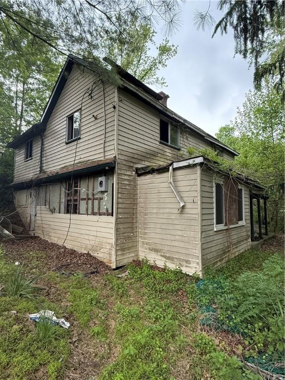102 Arch St, Jefferson Hills, PA 15025 - view of side of home featuring a chimney
