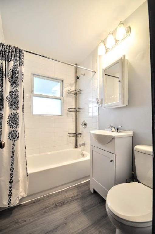 1025 Nevada St, South Strabane, PA 15301 - full bath featuring shower / tub combo with curtain, vanity, wood finished floors, and toilet