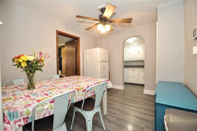 1025 Nevada St, South Strabane, PA 15301 - dining space with wood finished floors, a ceiling fan, baseboards, and arched walkways