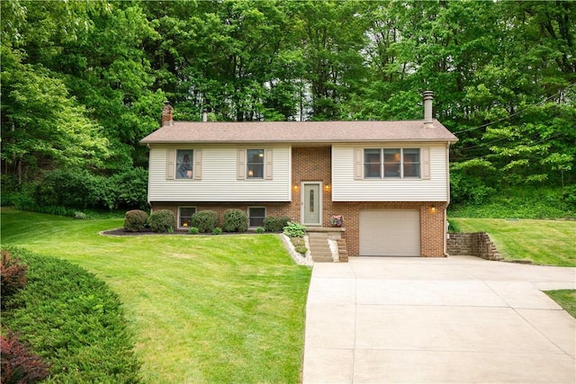240 Lindsay Rd, Jackson Twp But, PA 16063 - bi-level home featuring driveway, a chimney, a front lawn, a garage, and brick siding