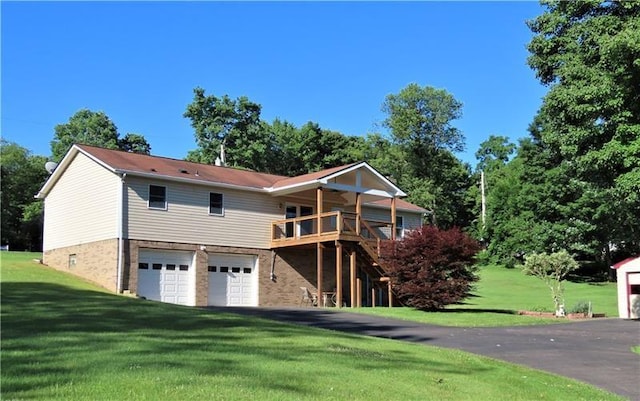 495 Glendale Rd, North Sewickley Twp, PA 15010 - view of front of home featuring an attached garage, a front lawn, a wooden deck, and driveway