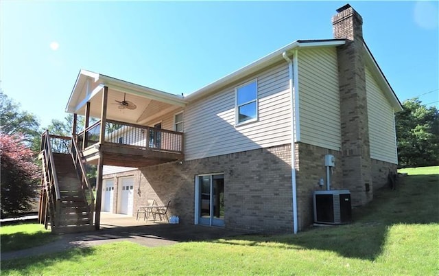 495 Glendale Rd, North Sewickley Twp, PA 15010 - back of property with a chimney, central AC unit, a lawn, and a garage