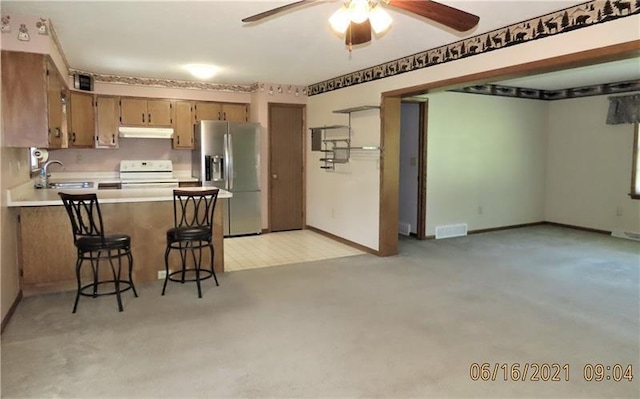495 Glendale Rd, North Sewickley Twp, PA 15010 - kitchen featuring stainless steel refrigerator with ice dispenser, under cabinet range hood, stove, a sink, and a ceiling fan