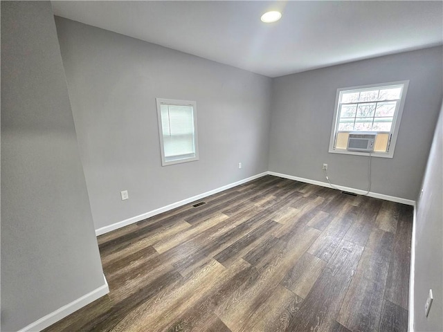 418 Short St, Donora, PA 15033 - empty room featuring healthy amount of natural light, dark wood-type flooring, and cooling unit