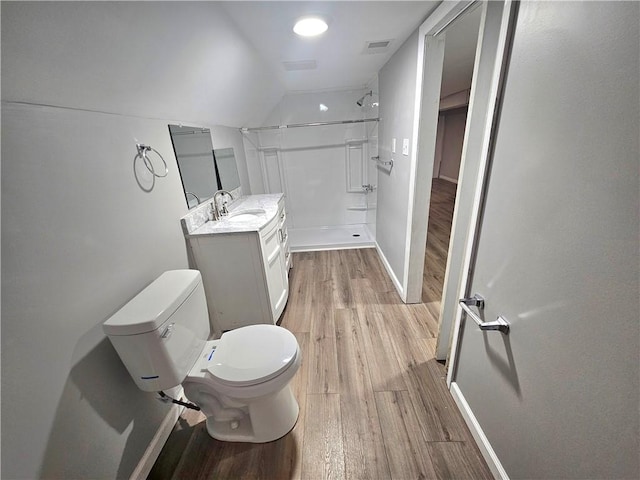 418 Short St, Donora, PA 15033 - bathroom featuring wood finished floors, a shower, vanity, and lofted ceiling