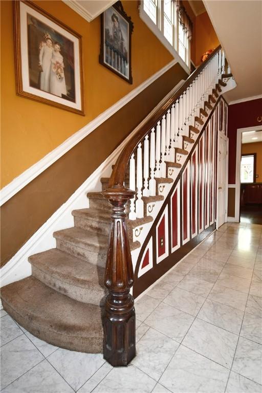 108 Locust St, Mount Oliver, PA 15210 - staircase featuring crown molding and marble finish flooring