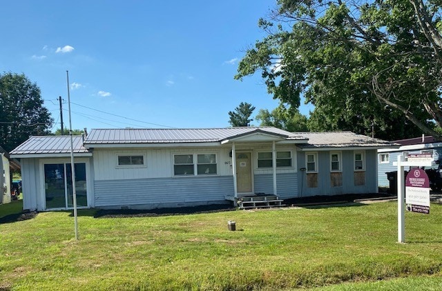 10672 Center Ave, Conneaut Lake, PA 16316 - ranch-style home with a front yard, a metal roof, board and batten siding, and crawl space